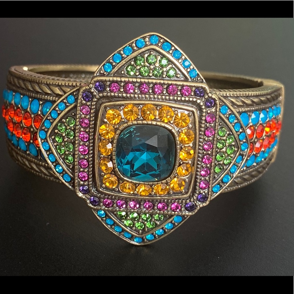 Bracelet cuff with hinge closure.